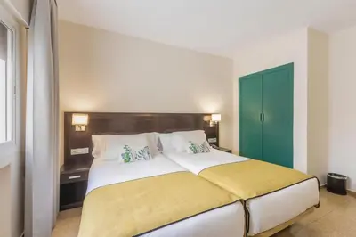 Cama o camas de una habitación en Itaca Colón by Soho Boutique
