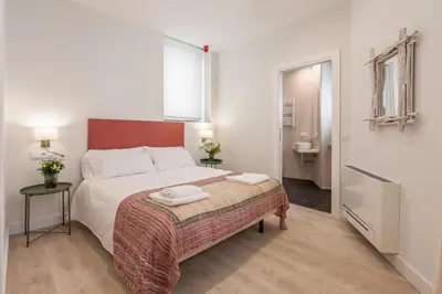Cama o camas de una habitación en Apartamentos RG Suites Jardines de Murillo