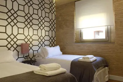 Cama o camas de una habitación en Apartamentos RG Suites Jardines de Murillo