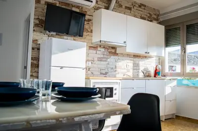 Una cocina o zona de cocina en Alojamientos Teatro