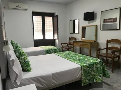 Cama o camas de una habitación en La Casa en el Centro