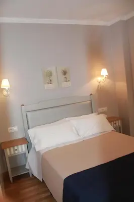 Cama o camas de una habitación en Hotel Torre del Oro