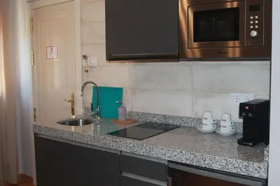 Una cocina o zona de cocina en Hotel Torre del Oro