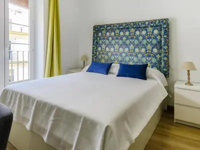 Cama o camas de una habitación en Living-Sevilla Feria