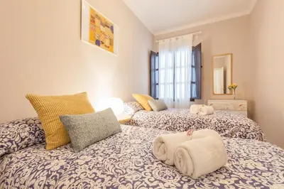 Cama o camas de una habitación en Elegante apartamento en el corazon de Sevilla.