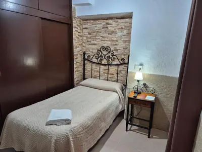 Cama o camas de una habitación en Pensión Javier