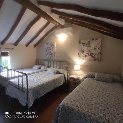 Cama o camas de una habitación en La Casa De La Abuela