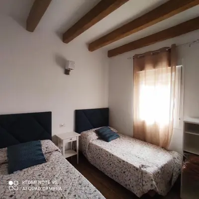 Cama o camas de una habitación en La Casa De La Abuela