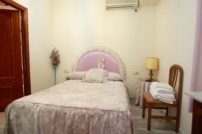 Cama o camas de una habitación en Hostal Jiménez