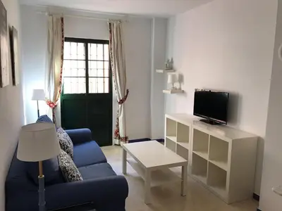 Una televisión o centro de entretenimiento en CLB Apartamento Alameda
