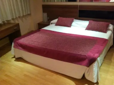 Cama o camas de una habitación en Hotel El Cruce Moraleda