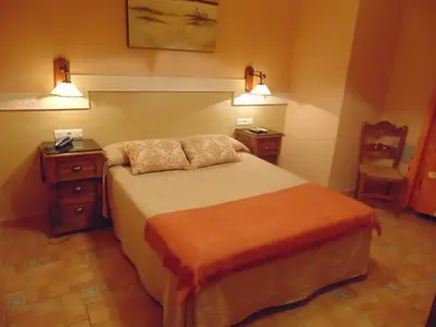 Cama o camas de una habitación en Hotel Sierra de Araceli Lucena