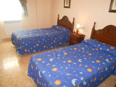Cama o camas de una habitación en Hostal El Polígono