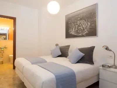 Cama o camas de una habitación en Apartamentos Turísticos Duque de Hornachuelos