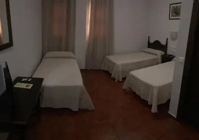 Cama o camas de una habitación en Hotel La Yedra