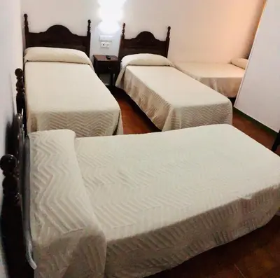 Cama o camas de una habitación en Hotel La Yedra