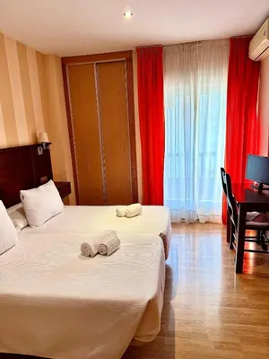 Cama o camas de una habitación en Hotel Fernando IV