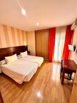 Cama o camas de una habitación en Hotel Fernando IV