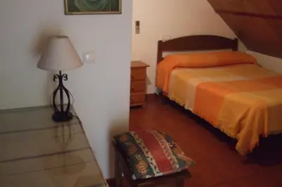 Cama o camas de una habitación en Hostal Alcázar