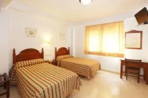 Cama o camas de una habitación en El Cisne Verde