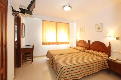 Cama o camas de una habitación en El Cisne Verde