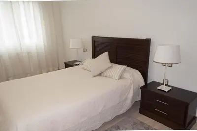 Cama o camas de una habitación en Céntrico, parking privado, al lado estación tren.