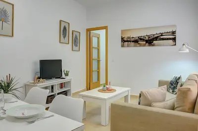Una televisión o centro de entretenimiento en Apartamento San Julian