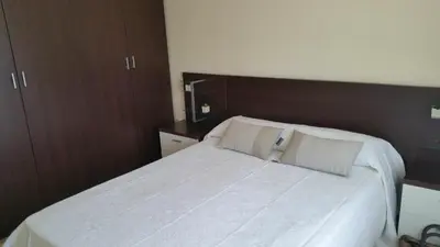 Cama o camas de una habitación en GRANJA - PARKING GRATIS - CLIMATIZADO