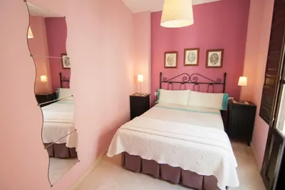 Cama o camas de una habitación en Apartamentos La Ribera Córdoba