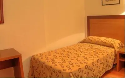 Cama o camas de una habitación en Hotel Torrezaf