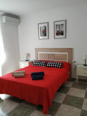 Cama o camas de una habitación en ALTILLO 25 GARAJE Y WIFI GRATIS