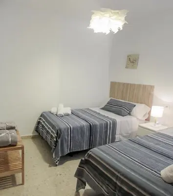 Cama o camas de una habitación en Paseos por Córdoba