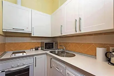 Una cocina o zona de cocina en Feria Palace Apartment