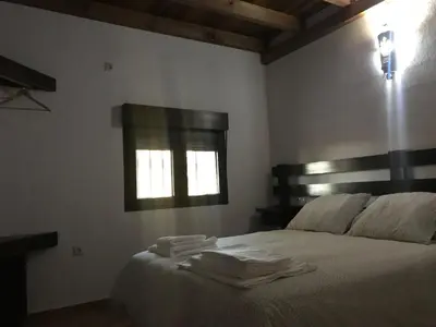 Cama o camas de una habitación en VTAR Don Benito, su casa rural en Gilena