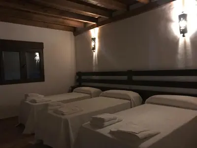 Cama o camas de una habitación en VTAR Don Benito, su casa rural en Gilena