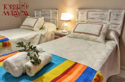 Cama o camas de una habitación en Torreón de Morayma