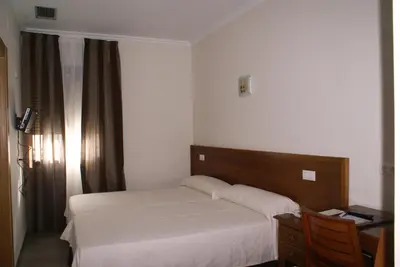 Cama o camas de una habitación en Hotel Gema