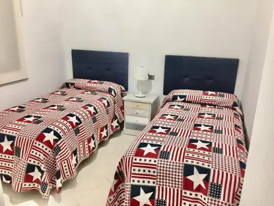 Cama o camas de una habitación en Ap Marqués d la Vega Parking Opcional
