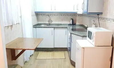 Una cocina o zona de cocina en HISPALIS SAN LUIS