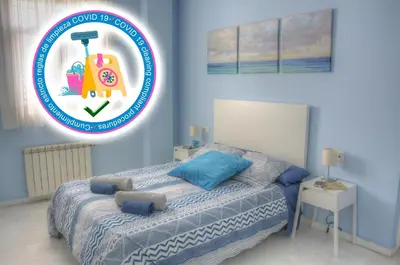 Cama o camas de una habitación en SEVILLA BUTTERFLY SUITES