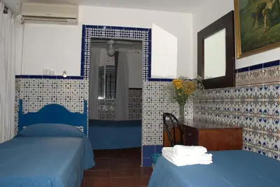 Cama o camas de una habitación en Pensión Santa María la Blanca