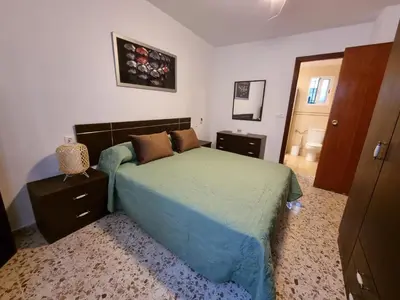 Cama o camas de una habitación en Vivienda Turística en la Muralla de San Basilio