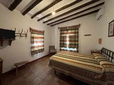 Cama o camas de una habitación en Posada de Jose Mª El Tempranillo