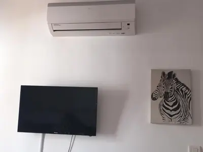 Una televisión o centro de entretenimiento en Apartamento Steven