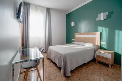 Cama o camas de una habitación en Hotel Chamizo