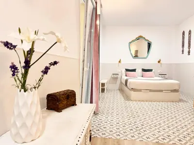 Cama o camas de una habitación en Palace House Hércules Apartments