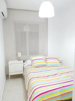 Cama o camas de una habitación en Luminoso y Confortable Apartamento