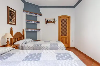 Cama o camas de una habitación en CASAMORA Casa Para Grupos cerca Caminito del Rey