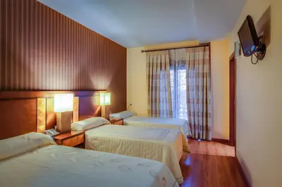 Cama o camas de una habitación en Hotel Ciudad de Martos