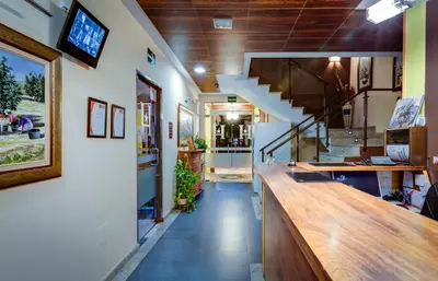 Una televisión o centro de entretenimiento en Hotel Ciudad de Martos